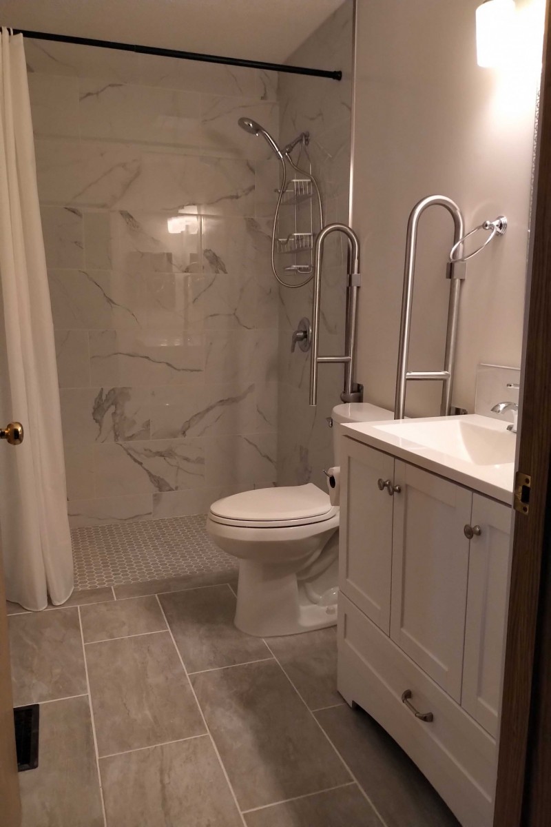 Completed accessible bathroom with low-entry shower and folding support bars