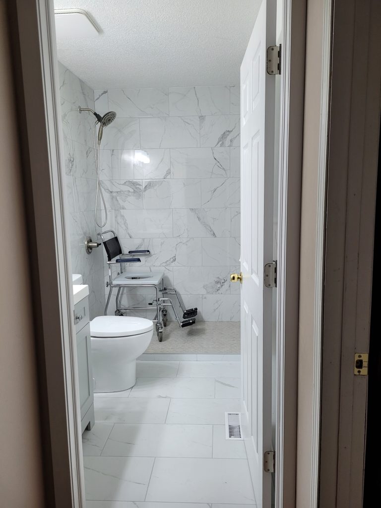 Accessible walk-in shower and gray vanity