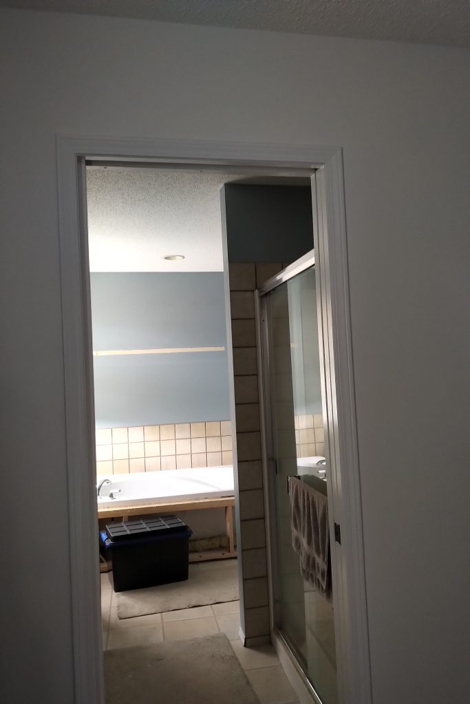 Before: dated ensuite seen from the doorway