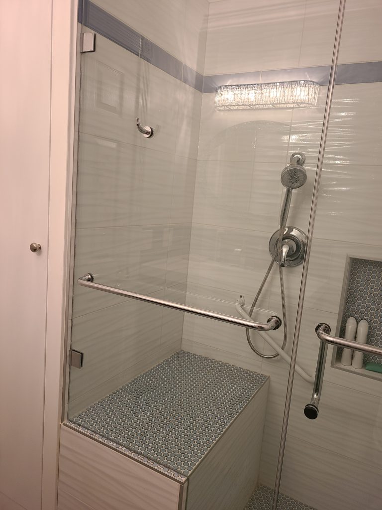 Accessible shower with bench and grab bars