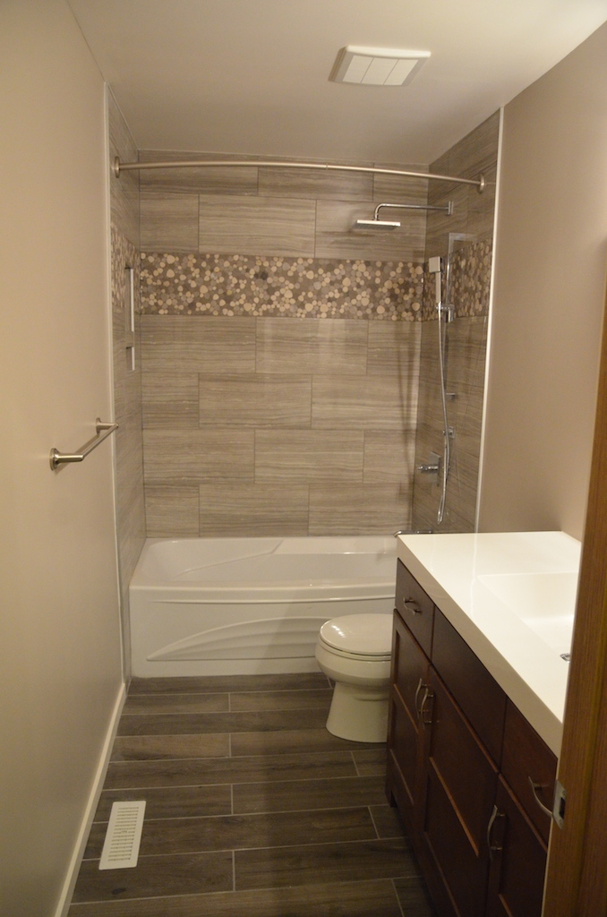 Tub-shower bathroom with mosaic detail