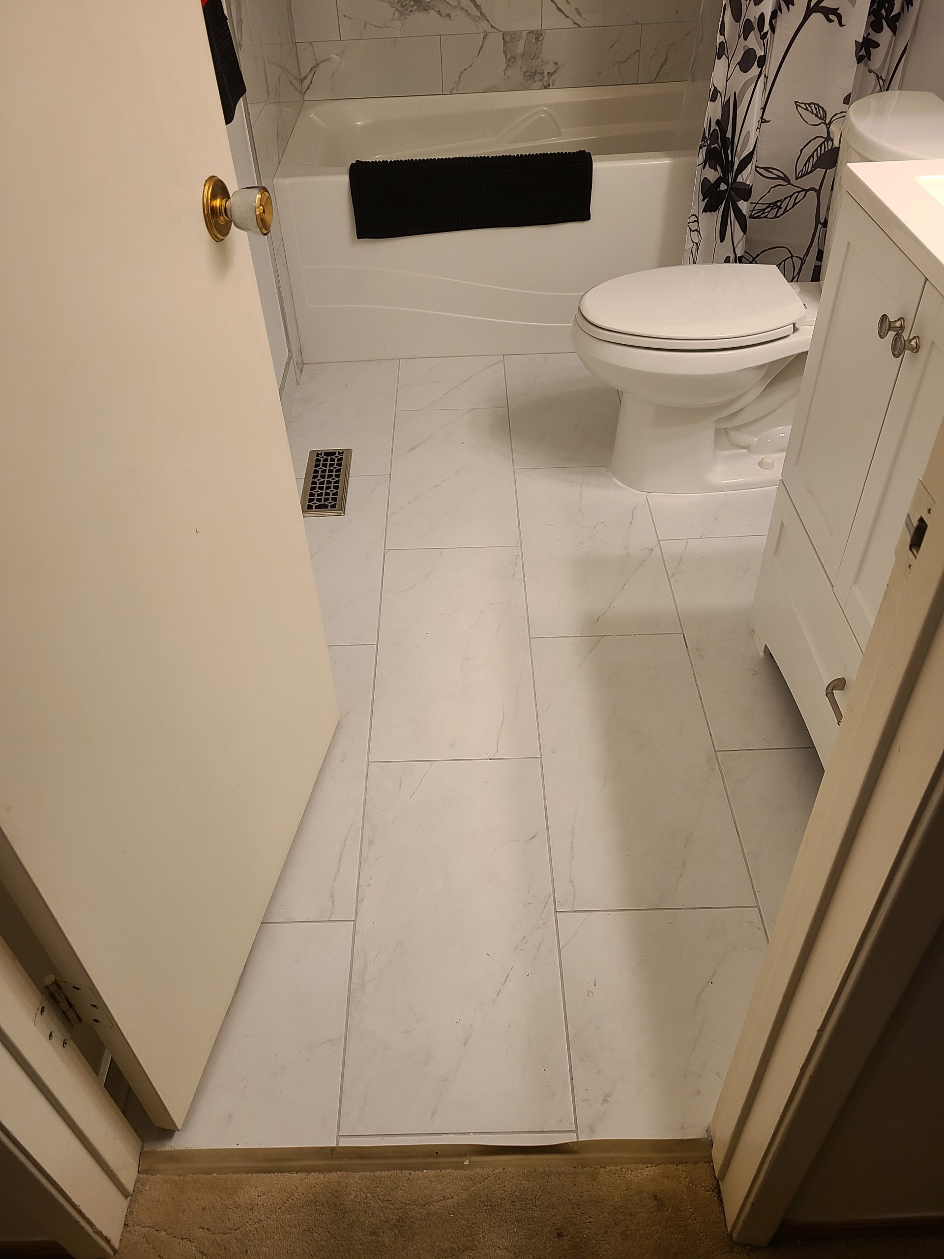 Tub‑shower bathroom with light tile
